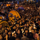 Pro-democracy protestors watch formal talks between student protest leaders and city officials on a video screen near the government headquarters in Hong Kong October 21, 2014. Hong Kong Chief Executive Leung Chun-ying said on Tuesday there was room for the committee that selects candidates for the territory's 2017 election to be made "more democratic." REUTERS/Carlos Barria (CHINA - Tags: POLITICS CIVIL UNREST BUSINESS) - RTR4AYKF
